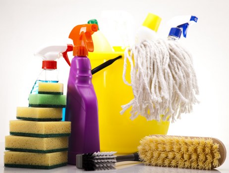 Vacuuming a mattress to remove dust and allergens